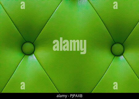 elegant green leather texture with buttons for pattern and background. Stock Photo