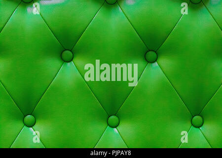 elegant green leather texture with buttons for pattern and background. Stock Photo