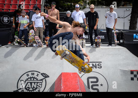 Skateboarders look on during practice in the Vans Pro Bowl during the Vans Park Series terrain skateboarding world championship tour as fans watch during the 6th day of the Australian Open of Surfing in Manly Beach, Australia. Stock Photo