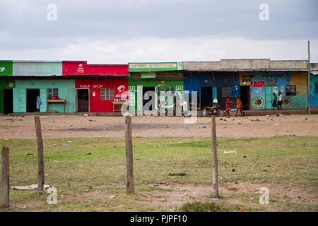 kenyan masai villages along the road to go to the masai mara reserve Stock Photo