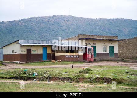 kenyan masai villages along the road to go to the masai mara reserve Stock Photo