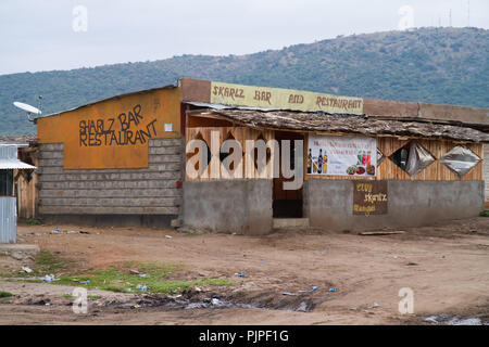 kenyan masai villages along the road to go to the masai mara reserve Stock Photo