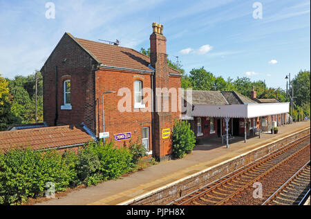 A view of the railway station on the Wherry Lines with old enamel signs still in place at Acle, Norfolk, England, United Kingdom, Europe. Stock Photo