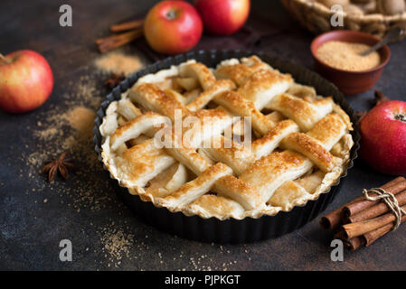 Homemade Apple Pies on rustic background. Classic autumn Thanksgiving dessert - organic apple pie. Stock Photo