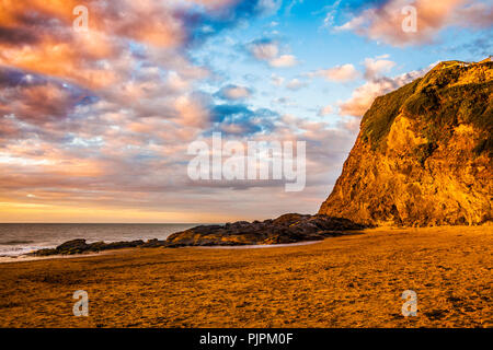 Sunset over the beach at Tresaith in Ceredigion, Wales. Stock Photo