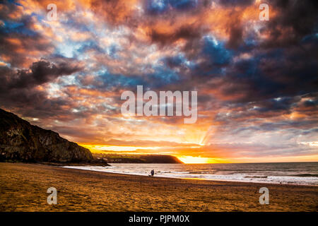 Sunset over the beach at Tresaith in Ceredigion, Wales, looking towards Aberporth. Stock Photo