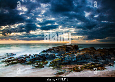Sunset over the beach at Tresaith in Ceredigion, Wales. Stock Photo