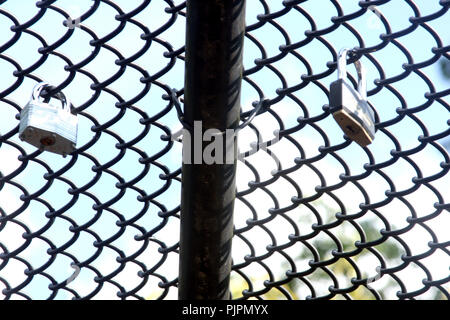 Locks hanged by people on the bridge in Farmville, VA, USA Stock Photo