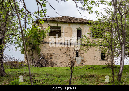 Abandoned and ruined stone house in Rhodope mountain, Bulgaria near the road to the famous Devil Bridge Stock Photo
