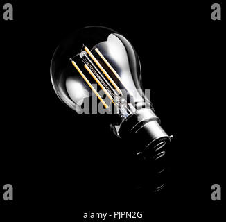 Low Energy Light Bulb on a dark background Stock Photo