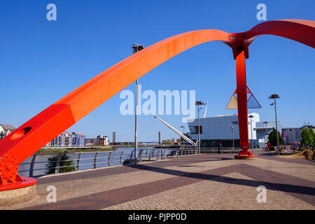 The Steel Wave Sculpture City Footbridge and University of South Wales River Usk Newport Gwent Wales Stock Photo