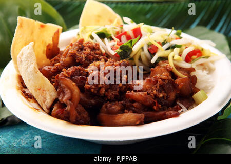 Nasi Campur Bali. Popular Balinese meal of rice with meat. Typical Malaysian street food lunch mixed rice Stock Photo