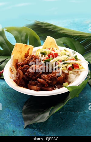 Nasi Campur Bali. Popular Balinese meal of rice with meat. Typical Malaysian street food lunch mixed rice Stock Photo