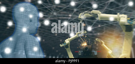 iot trend industry 4.0 concept,industrial engineer using artificial intelligence ai (augmented, virtual reality) with wire mesh to monitoring machine  Stock Photo