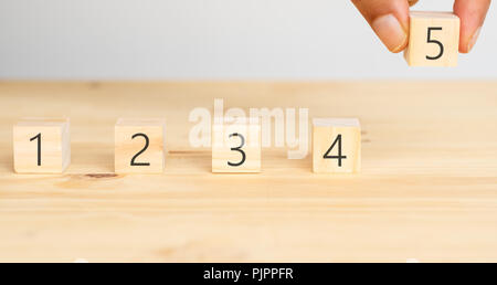 business successful concept, hand man try to put the 5 (five) rating to the business or service  customer experience , the achievement to complete the Stock Photo