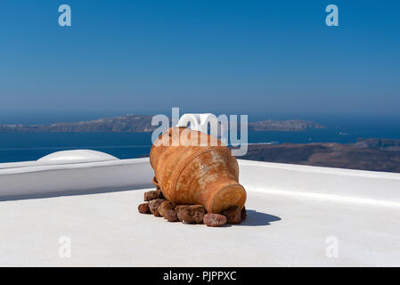 Antique ceramic vase on a roof a house at Santorini island, Greece Stock Photo