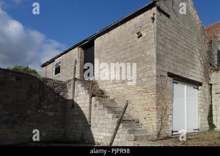 Built in exterior stone stairs on a 17th Century Barn on the Sandbeck Park Estate a Palladian country house in Maltby, South Yorkshire, England. Stock Photo