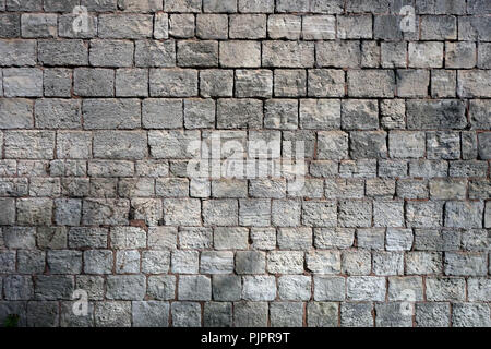 Closeup courses of stone in the wall of a 17th Century Barn Stock Photo