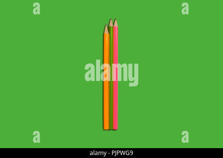 two new pencils lying on a green background. concept of office supplies. free copyspace Stock Photo