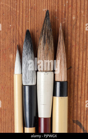 traditional writing brush isolated on wood background, Japanese writing brush, Chinese writing brush Stock Photo