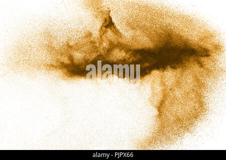 Black sand explosion against white background.The particles of sand splattered on white background Stock Photo
