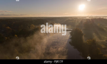 Morning smoke on the water Ulbroka lake Aerial drone top view Latvia Stock Photo