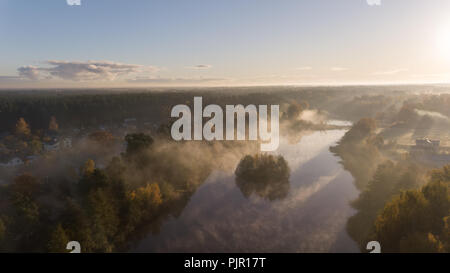Morning smoke on the water Ulbroka lake Aerial drone top view Latvia Stock Photo