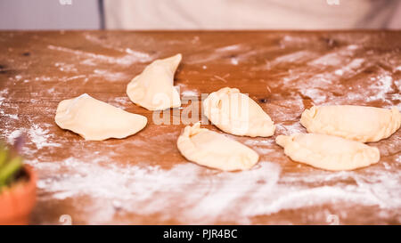 Step by step. Making home made empanadas with different fillings. Stock Photo