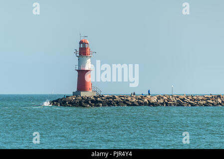 Rostock, Germany - May 26, 2017: View with lighthouse and Baltic Sea at Warnemunde, Rostock, Mecklenburg-Western Pomerania, Germany. Stock Photo