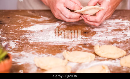 Step by step. Making home made empanadas with different fillings. Stock Photo