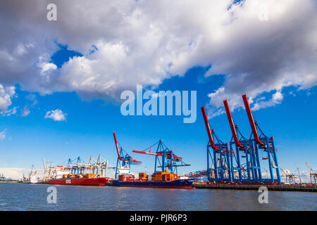 HAMBURG, GERMANY - JUNE 25, 2014: Cranes of Port of Hamburg (Hamburger Hafen, Terminal Burchardkai) on Elbe river, Germany. The largest port in German Stock Photo