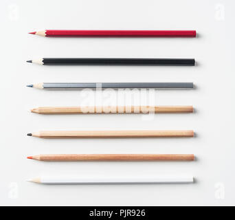 Top view of collection of pens on white background desk for mockup Stock Photo