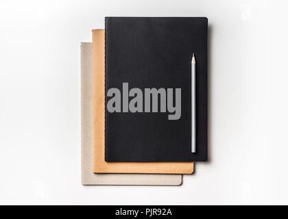 Design concept - Top view of many notebooks and color pencil isolated on white background for mockup Stock Photo