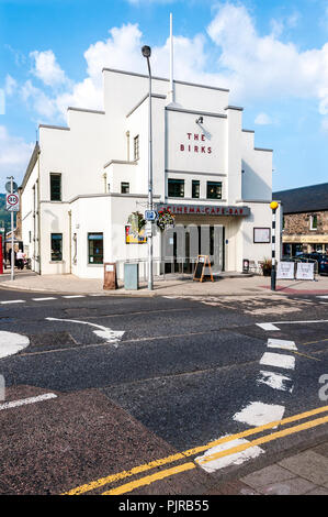 The white art deco façade of the recently renovated Birks Cinema - Café - Bar dominates the corner of two roads in the main square of Aberfeldy Stock Photo