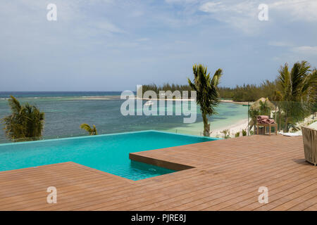 Jamaica White Sand Beaches with Blue Water and Green Palm Trees Stock Photo