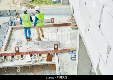 Modern constructors working on new house Stock Photo