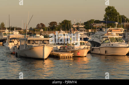 Pleasure and fishing boats docked in the harbor at Newburyport, Mass., USA, on a late summer afternoon. Stock Photo