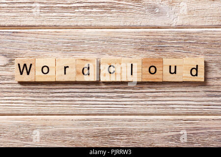 Word cloud word written on wood block. Word cloud text on table, concept. Stock Photo