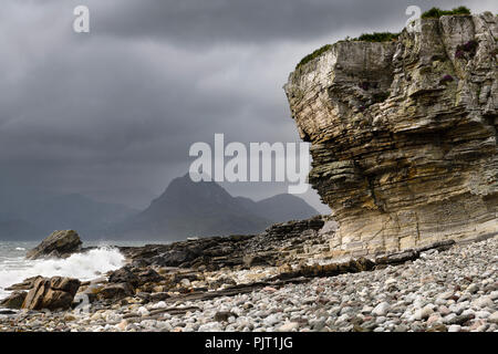 Elgol beach at Port na Cullaidh with Red Cuillin Mountains under clouds on Loch Scavaig Scottish Highlands Isle of Skye Scotland UK Stock Photo