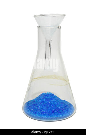 chemical experiment:  blue powder, poured into heap, through the small lab funnel on a bottom of transparent conical flask. isolated, with clipping pa Stock Photo