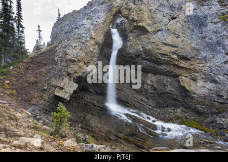 Water Falling through Keyhole of Natural Bridge Rock Arch Formation in Banff National Park, Canadian Rocky Mountains Stock Photo