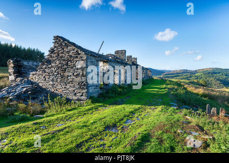 Ruined buildings at the abandoned Rhos Quarry on the side of Moel Siabod mountain near Capel Curig in Snowdonia National Park in Wales Stock Photo