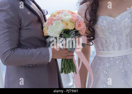 Bouquet and the couple who are married, vintage tone. Stock Photo