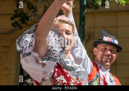 PRAGUE, CZECH REPUBLIC - JULY 1, 2018: People in Moravian folk costumes parading at Sokolsky Slet, a once-every-six-years gathering of the Sokol movem Stock Photo