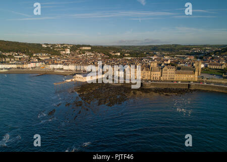 Aerial drone view of ABERYSTWYTH, a small university and market town on the Cardigan Bay coast, west Wales UK, on a bright sunny September evening. [Image made by a CAA  licenced amd insured drone operator] Stock Photo