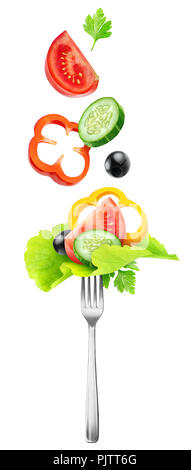Isolated vegetables. Fresh salad components (tomato, cucumber, yellow bell pepper, lettuce and black olives) over a fork isolated on white background  Stock Photo