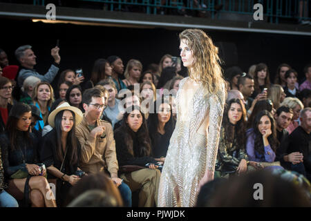 A model walks the Julien Macdonald Spring/Summer 17 Collection runway show during London Fashion Week on September 17, 2016, in London, United Kingdom. Julien Macdonald OBE is a Welsh fashion designer who appeared as judge on Britain's Next Top Model, named as 'British Fashion Designer of the Year' in 2001 and was appointed as chief designer at Givenchy. Stock Photo