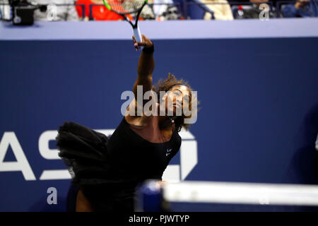 New York, USA. 8th September 2018.  US Open Tennis:  Serena Williams serves during her loss to Naomi Osaka of Japan in the US Open women's final. Williams was penalized a game at 4-3 in the final set, which added controversy to the match. Credit: Adam Stoltman/Alamy Live News Stock Photo