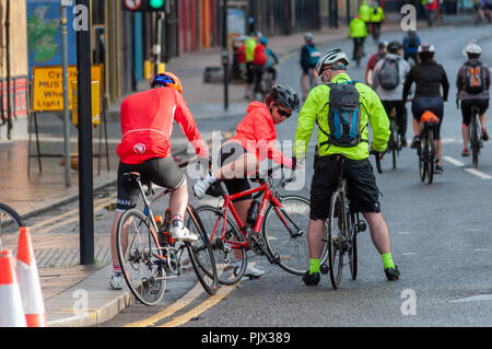 Glasgow, Scotland, UK. 9th September, 2018. Cyclists checking their bikes at the start of  Pedal For Scotland which comprises three events, the 100 mile Big Belter from Glasgow to Edinburgh, the 45 mile Classic Challenge from Glasgow to Edinburgh and the 10 mile Wee Jaunt from Linlithgow to Ingliston. Credit: Skully/Alamy Live News Stock Photo