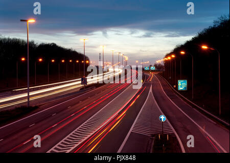 Traffic over the E40 motorway at sunset (Belgium, 01/04/2011) Stock Photo